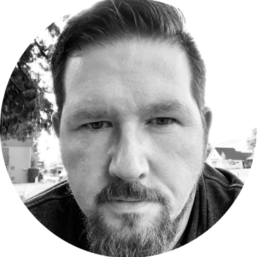 A circular, portrait photograph in black-and-white of Jason Roy, founder of SiteLine Services