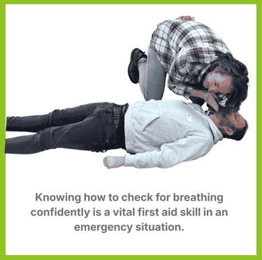 A man knelt over another man with his ear close to his face. He is listening for breathing.