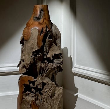 Handcrafted woven bamboo basket with intricate knot details and a sturdy handle for rustic storage.