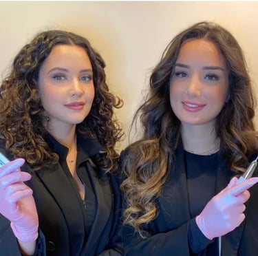 two women in suits and gloves holding toothbrushes