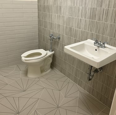 fully renovated bathroom with different tiles