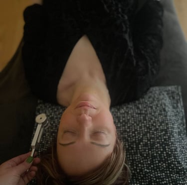 a woman during a sound therapy session