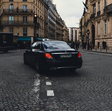 a car driving down a street with a lot of traffic