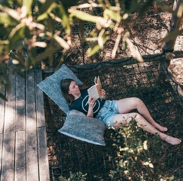 person reading a book on a retreat