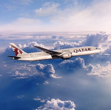 a plane flying over a cloud filled sky