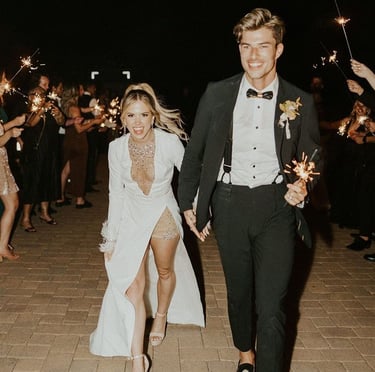 Bride and groom holding hands during wedding ceremony