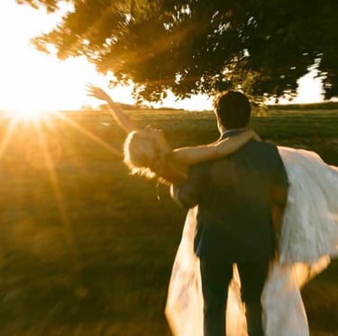 Bride and groom kissing at golden hour