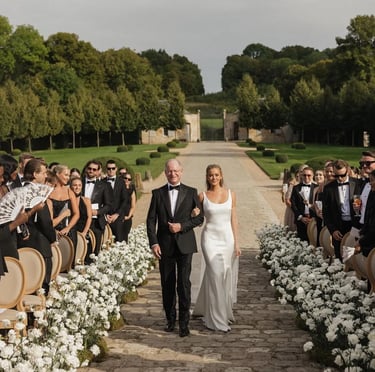 Bride walking down the aisle in lace wedding gown