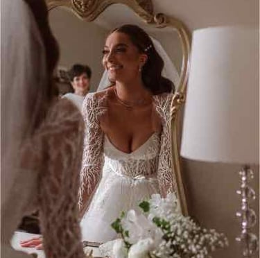 Bride getting ready with veil and pearl earrings
