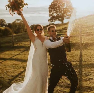 Bride holding a bouquet of pastel flowers