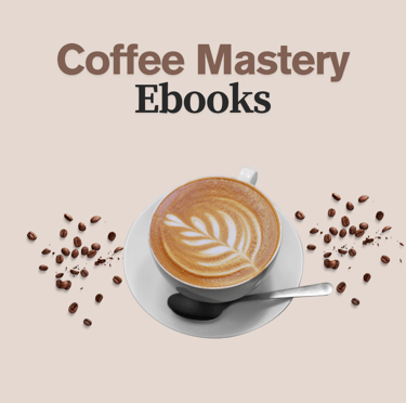 a cup of coffee with a spoon and a spoon in front of a cup of