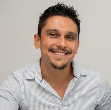 a male translator with a beard and a mustache on his face