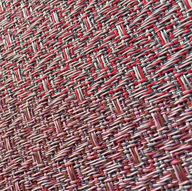 a close up of a red and white woven fabric with a red and white background