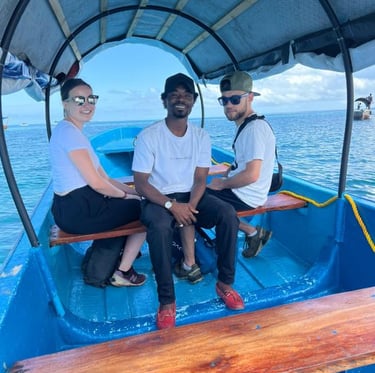 A smiling guest with a local guide en route to Prison Island. Friendly and knowledgeable guides on every tour.