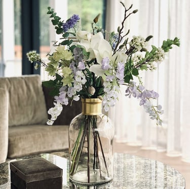 a vase with flowers on a table