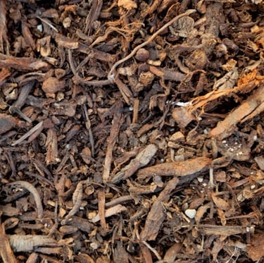 mulch out of wood chips with a dark brown color