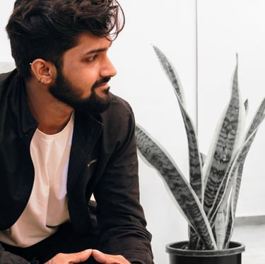 Side Profile photo of a Tattoo Artist smiling
