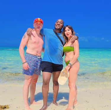 A local Zanzibar tour guide with a couple of tourists enjoying the stunning beaches of Mnemba Island.