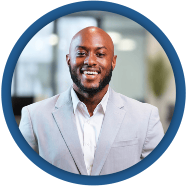 a man in a suit and tie smiling