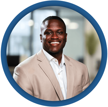 a man in a suit and tie smiling