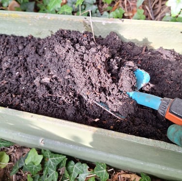 brown soil in a raised garden bed