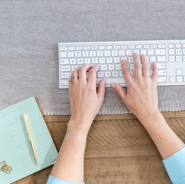 a virtual assistant typing on a keyboard