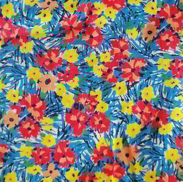 a colorful floral print fabric with a blue and yellow background