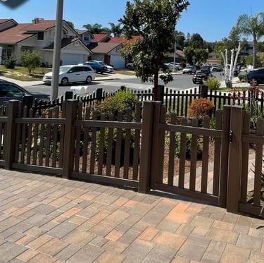 Brown vinyl picket fence