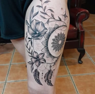 Ornamental leg tattoo