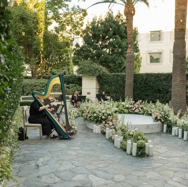 String quartet with harp performs for a luxury marriage proposal
