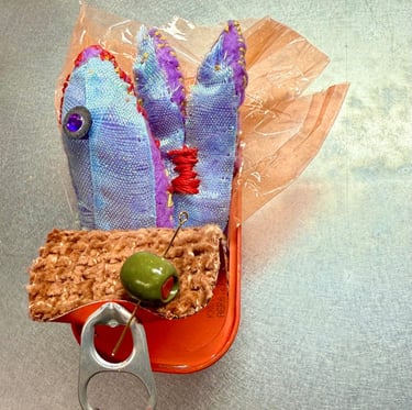 tinned fish sculpture blue/purple shiny fish in. orange tin