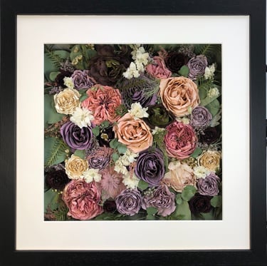 a flower wall style preserved wedding bouquet  of pinks and pinks in a frame