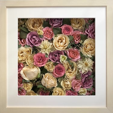 a beautiful summery flower wall style preserved wedding bouquet in a frame