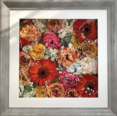 a bright  flower wall style preserved wedding bouquet in a frame