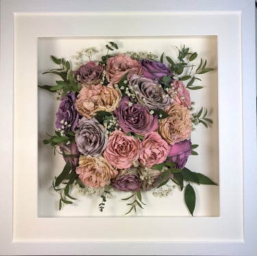 Birdseye view preserved wedding bouquet of roses in a frame