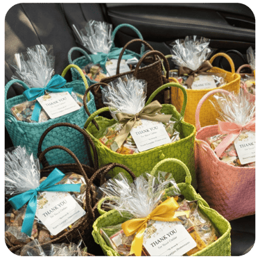 Bulk order of woven plastic souvenir bags prepared and packaged for shipment.