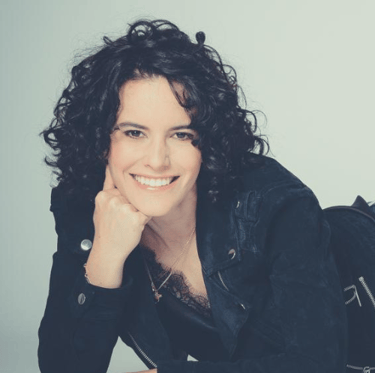 a woman with a black jacket and a backpack