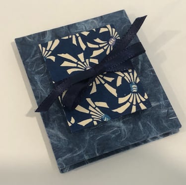 Accordion with Japanese paper and small accordion on cover, ribbon detail