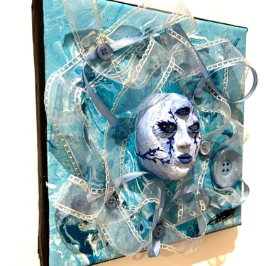 a painting of a face with a blue face and tissus