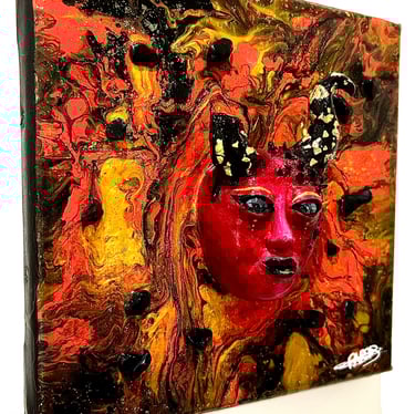 Ilona Paris tableau d'un visage sculptée rouge avec des cornes dont une cassée