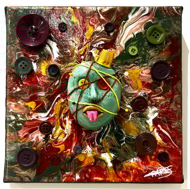 a painting of a face with buttons