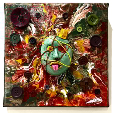 Ilona Paris tableau d'une peinture d'un visage avec du fil et des yeux boutons