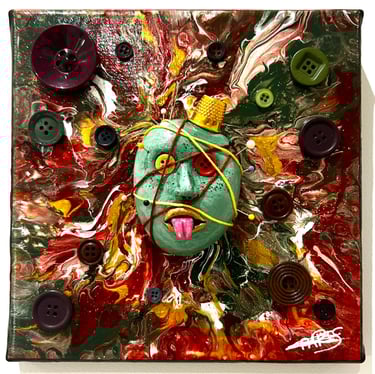 a painting of a face with buttons