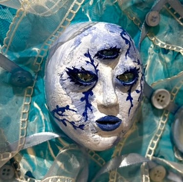 a painting of a face with a blue face and tissus and three eyes