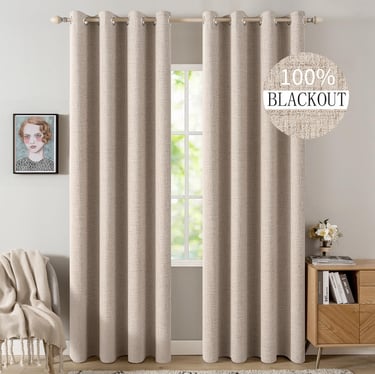 Elegant beige thermal insulated 100% blackout curtains for a bedroom window.