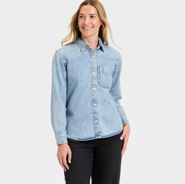 woman wearing a light wash long sleeve denim button-down shirt from target universal thread