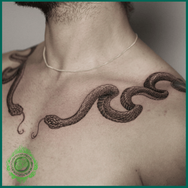 Realistic symmetrical snake tattoo on the chest by MaxDuong Tattoo in Da Nang