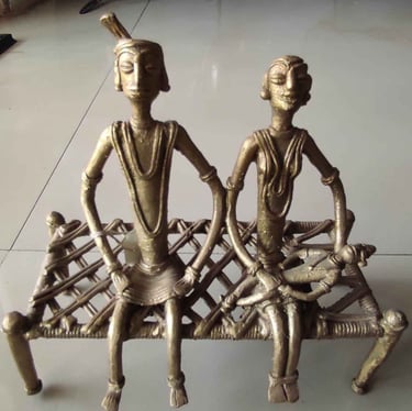"Brass village family seated on traditional Indian woven cot–handcrafted Bastar tribal art-Export-grade"