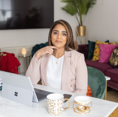 A photo of Anita sitting at a desk