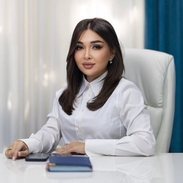 a woman in a white shirt and a laptop
